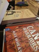 stack of donated books on a table